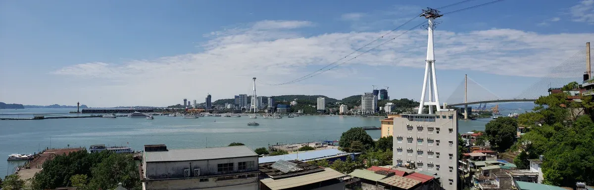 Bai Chay bridge and cable car tower on the Ha Long waterfront, start of a Ha Long Bay junk boat cruise