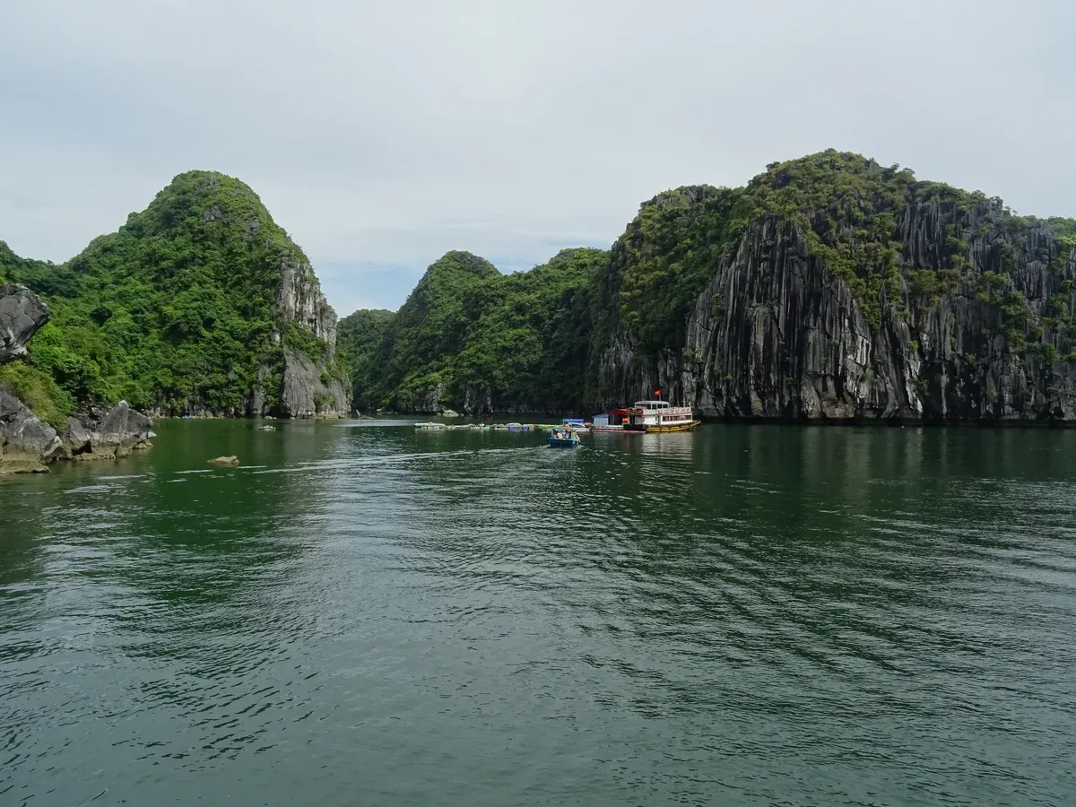 Narrow channel between green karsts in Lan Ha Bay on a Lan Ha Bay day cruise